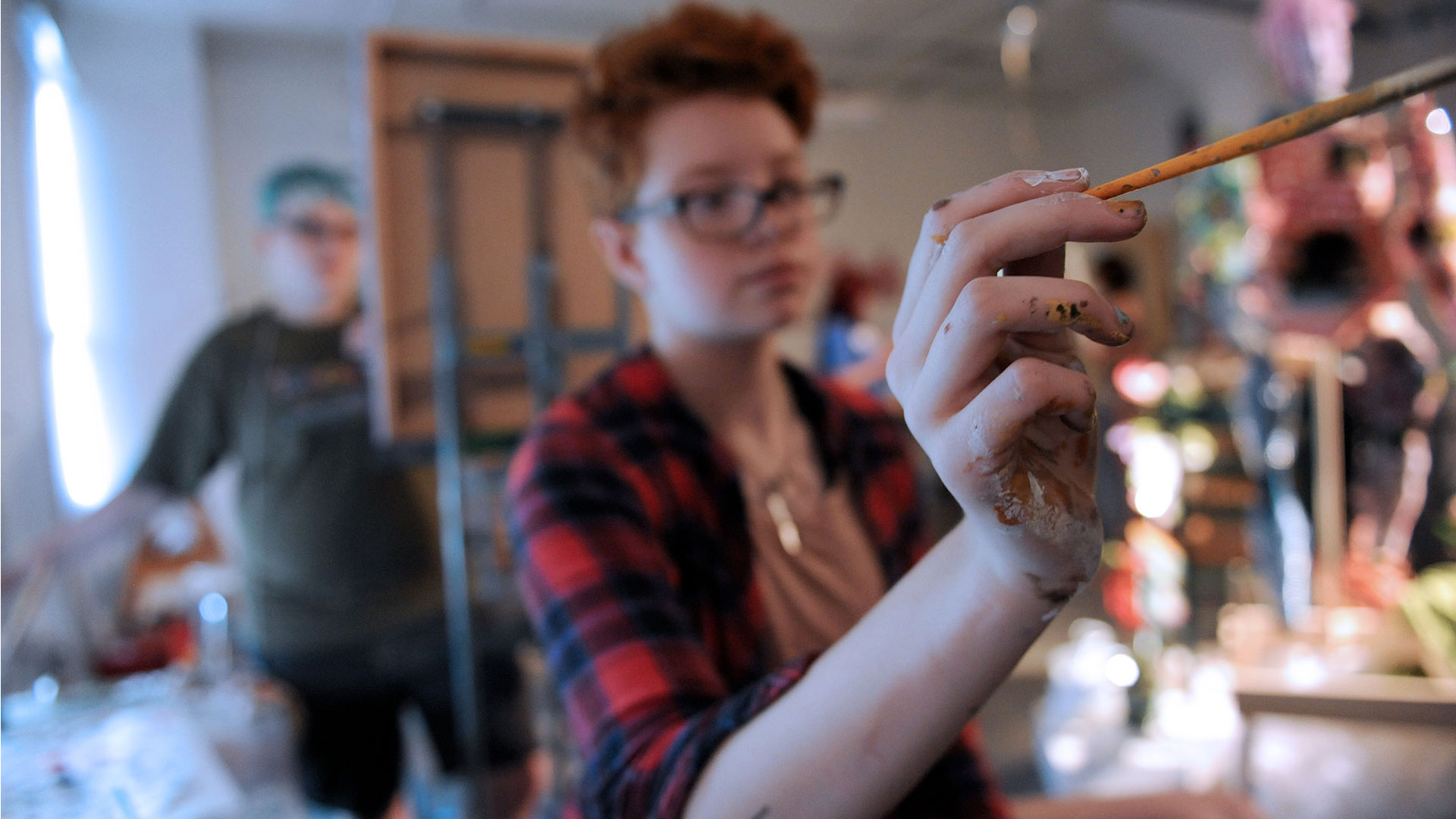 Cornish student painting with classmate watching