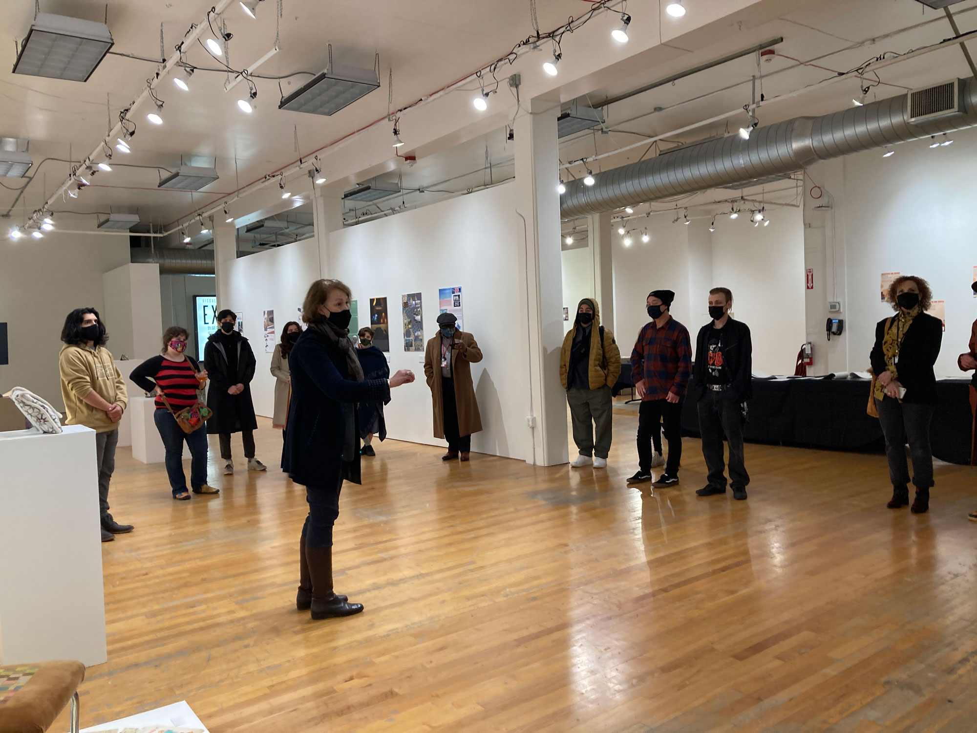 A group of people in a gallery.